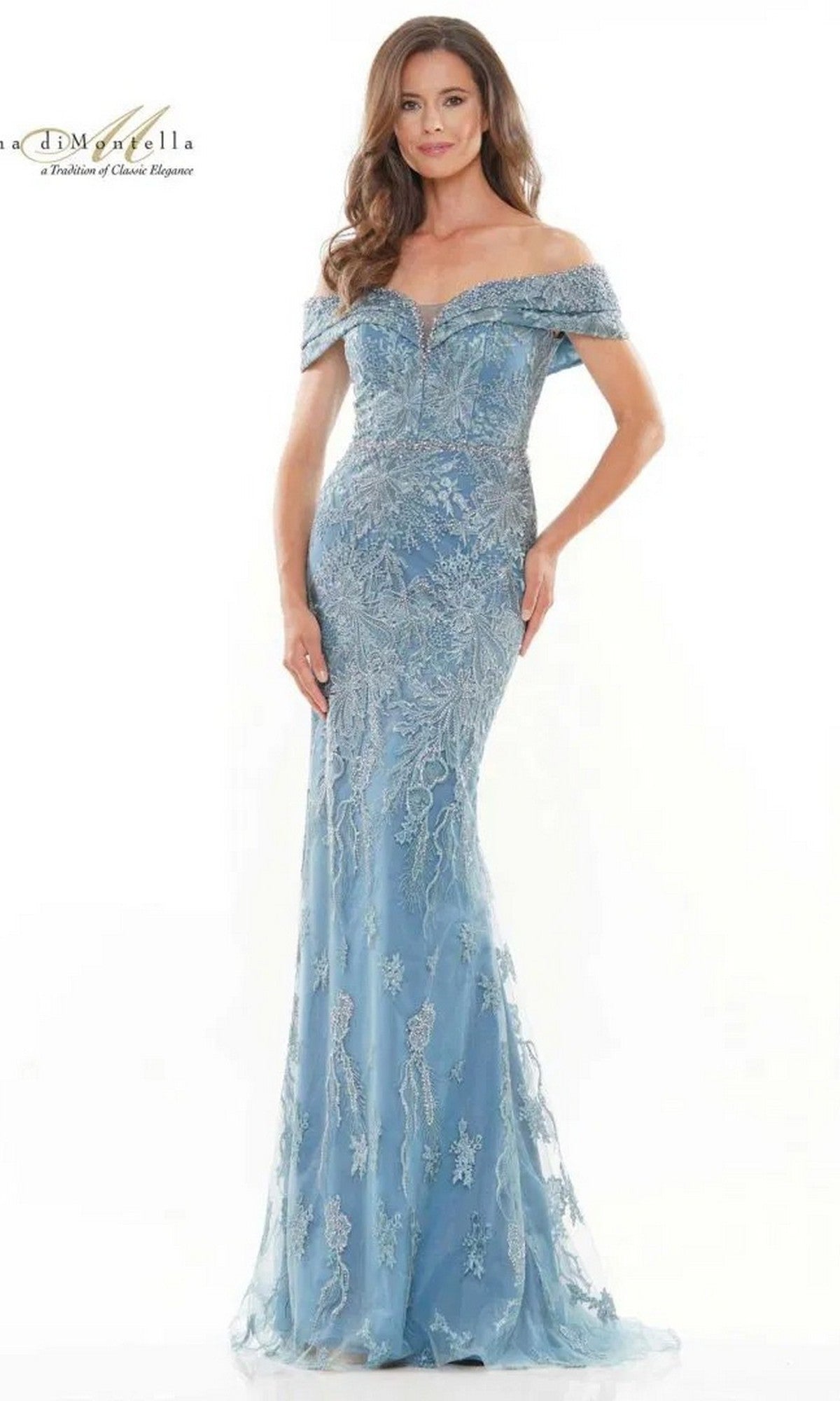 A woman models the Rina Di Montella RD2737 long formal dress in Wedgewood, an off-the-shoulder, floor-length gown with sheer lace and a sparkling beaded waist, set against a plain white background.